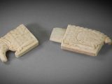 two carved ivory figurines of elephants and a bird