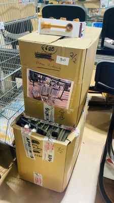 many boxes that are stacked on top of each other in a store