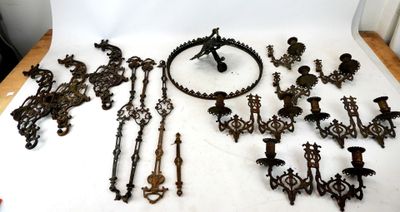 an assortment of antique metal items on a white surface