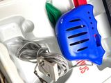 a blue and red blow dryer in a white box