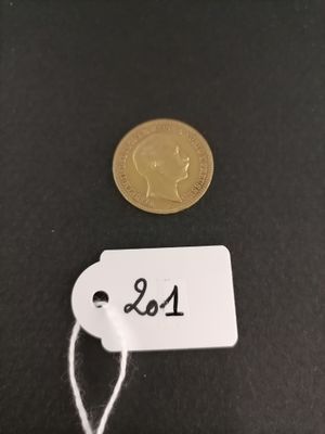 a close up of a coin with a tag attached to it