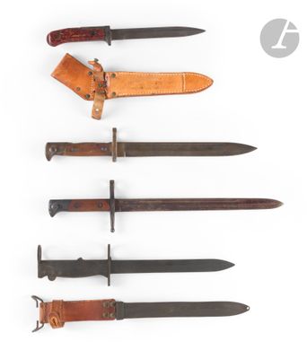 a group of five different types of knives on a white surface