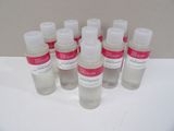 six bottles of hand sanitizer sitting on a white surface