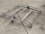 a metal roof rack that is sitting on the ground