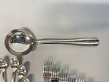 many spoons, forks, and spoon spoons on the table