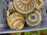 a blue box with a bunch of cups and saucers in it