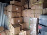 many boxes stacked on top of each other in a storage area