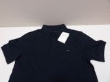 a black polo shirt with a white tag on it