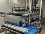 a machine that has a conveyor belt in the middle of it