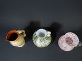 three vases sitting next to each other on a table