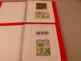 a red book with stamps on it sitting on a table