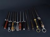 several different types of knives are lined up on a black surface
