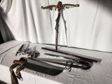 a table with a cross, knife, and other items on it