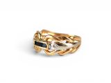 an image of a gold ring with a white diamond and a black diamond