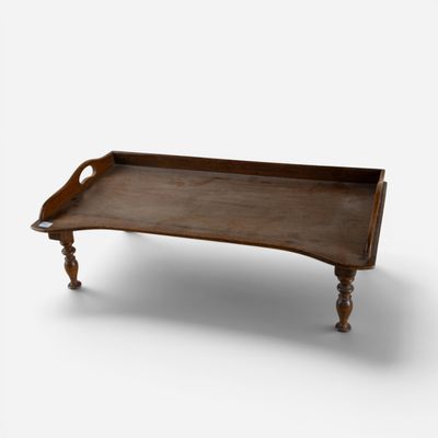 a wooden tray that is sitting on a table