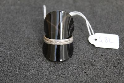 a small silver object with a tag on it