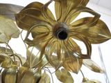 a large gold flower hanging from the ceiling