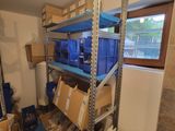 a room with a lot of boxes and boxes on the shelves