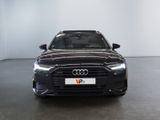 the front of a black audi vehicle in a white room