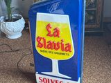 a blue and yellow sign with a glass of beer on it