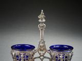 a pair of silver and blue glass bowls on stands