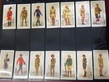 a lot of pictures of men in uniforms on a table