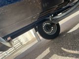 a close up of a car ' s tire on the street