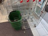 many shopping carts that are lined up in a store