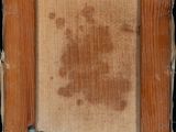 an old picture of a wooden frame with a number on it