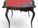 a black and red table with a red top on a white background