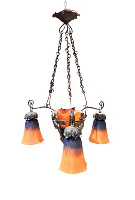 an orange and blue chandelier hanging from a chain