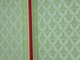 a green and red book opened to reveal a pattern