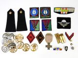 several military badges and badges are laid out on a white surface