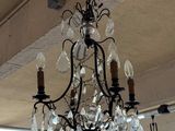 a chandelier hanging from the ceiling in a room