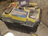 a black and yellow box with tools on top of it