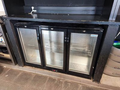 an image of a black glass door refrigerator in a kitchen