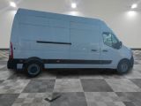 a picture of a white van parked in a garage