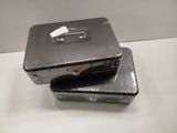 two suitcases that are sitting on a table