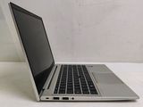 a laptop that is sitting on a white table