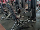 a gym with a lot of machines in the room