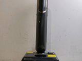 an image of a black vacuum cleaner on a white surface