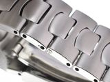 a close up of a watch that is on a white surface