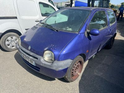 a small blue car that is parked in a parking lot
