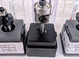 four different types of machine parts are sitting on a table