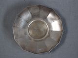 a silver plate that is on a table