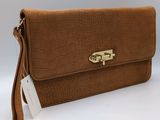a brown crocodile skin clutch bag with a gold clasp
