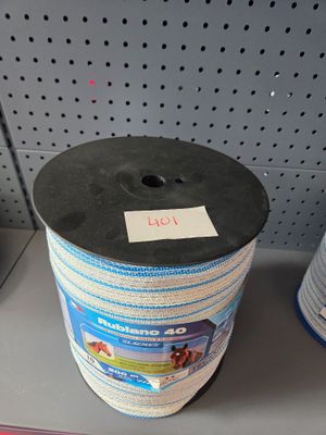 a spool of rope on a shelf in a store