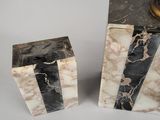 pair of black and white marble bookends with gold accents