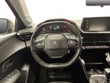 the interior of a car with a steering wheel and dashboard controls
