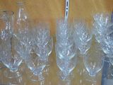 many empty wine glasses sitting on a table
